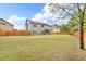 Spacious backyard with a well-maintained lawn and a wood fence that offers privacy at 1304 Slate Bend Dr, Dacula, GA 30019
