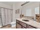 Neutral toned bathroom featuring a granite countertop, modern vanity, and shower with curtain at 1304 Slate Bend Dr, Dacula, GA 30019