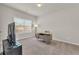 Clean and bright bedroom with plush carpeting, modern desk, and ample natural light at 1304 Slate Bend Dr, Dacula, GA 30019