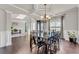 Elegant dining room with hardwood floors, crown molding, and coffered ceilings at 1304 Slate Bend Dr, Dacula, GA 30019