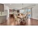 Eat-in kitchen features stainless steel appliances, dark wood cabinets, and a center island at 1304 Slate Bend Dr, Dacula, GA 30019