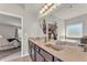 This main bathroom has double sinks, granite countertops, a jetted tub, and a separate shower at 1304 Slate Bend Dr, Dacula, GA 30019