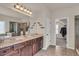 The main bathroom has double sinks, granite countertops, a jetted tub, and a separate shower at 1304 Slate Bend Dr, Dacula, GA 30019