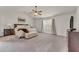 Spacious main bedroom featuring a ceiling fan, ensuite bathroom, and neutral decor at 1304 Slate Bend Dr, Dacula, GA 30019