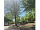 Street view of community sign surrounded by mature shade trees at 1304 Slate Bend Dr, Dacula, GA 30019