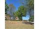 Stone community sign surrounded by trees and beautiful landscaping on a sunny day at 1304 Slate Bend Dr, Dacula, GA 30019