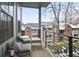 Cozy balcony with outdoor seating offering a view of surrounding buildings and neighborhood at 200 Chestnut Cir, Atlanta, GA 30342