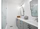 Bathroom featuring dual sinks, ample counter space, and a glass-enclosed shower at 200 Chestnut Cir, Atlanta, GA 30342