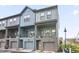 Stylish townhome featuring contemporary architecture, private balconies, and an attached garage at 200 Chestnut Cir, Atlanta, GA 30342