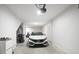 A well-lit garage with white walls and a white car parked inside at 200 Chestnut Cir, Atlanta, GA 30342