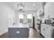 Contemporary kitchen boasts quartz counters, stainless appliances, and modern cabinetry at 200 Chestnut Cir, Atlanta, GA 30342
