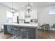 Beautiful kitchen with a large island, white cabinets, and modern pendant lighting at 200 Chestnut Cir, Atlanta, GA 30342