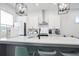 Modern kitchen with white cabinets, stainless steel appliances and a large island with seating at 200 Chestnut Cir, Atlanta, GA 30342