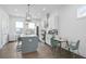 Modern kitchen features white cabinets, stainless steel appliances, and an island with seating at 200 Chestnut Cir, Atlanta, GA 30342