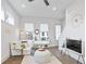 Bright living room boasts hardwood floors, plentiful natural light, and modern decor at 200 Chestnut Cir, Atlanta, GA 30342