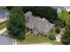 Overhead shot of the home, highlighting the roof, yard, and proximity to lush greenery at 3818 Bay Forest Way, Loganville, GA 30052