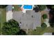 Aerial view of the property showcasing the roof, landscaping, and surrounding greenery at 3818 Bay Forest Way, Loganville, GA 30052