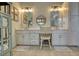 Bright bathroom featuring a double vanity with shaker cabinets and mirrors that create symmetry and visual appeal at 3818 Bay Forest Way, Loganville, GA 30052