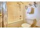 Bathroom with a shower and bathtub combination, with a white shower curtain and rack for towels at 3818 Bay Forest Way, Loganville, GA 30052