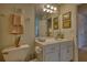 Bright bathroom featuring a white vanity, decorative accents, and 'I LOVE YOUR FACE' sign at 3818 Bay Forest Way, Loganville, GA 30052