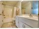 Bright bathroom featuring a shower-tub, single vanity and white fixtures at 3818 Bay Forest Way, Loganville, GA 30052