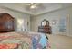 Spacious bedroom with tray ceilings, wood furniture and access to the outdoors offering a luxurious retreat at 3818 Bay Forest Way, Loganville, GA 30052