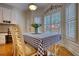 Cozy breakfast nook with a view of the outdoors and seating for four at 3818 Bay Forest Way, Loganville, GA 30052