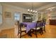 Spacious dining room features hardwood floors, elegant trim, and views into the adjacent rooms at 3818 Bay Forest Way, Loganville, GA 30052