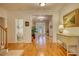 Entryway with hardwood floors leading to front door and views of living spaces at 3818 Bay Forest Way, Loganville, GA 30052