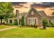 Charming stone and siding home with well-manicured lawn and mature landscaping at 3818 Bay Forest Way, Loganville, GA 30052