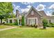 Charming stone and siding home with well-manicured lawn and mature landscaping at 3818 Bay Forest Way, Loganville, GA 30052