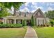 Beautifully landscaped home with stone accents, covered porch, and inviting curb appeal at 3818 Bay Forest Way, Loganville, GA 30052