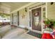 Inviting front porch featuring rocking chairs, stylish decor, and well-maintained landscaping at 3818 Bay Forest Way, Loganville, GA 30052