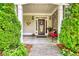Inviting front porch with stone accents, decorative wreath, and charming decor at 3818 Bay Forest Way, Loganville, GA 30052