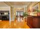 Elegant hallway showcasing hardwood floors, stylish decor, and views into the living spaces at 3818 Bay Forest Way, Loganville, GA 30052