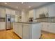 Beautiful kitchen with an island, stainless steel appliances, and ample cabinet space at 3818 Bay Forest Way, Loganville, GA 30052