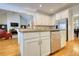 Bright kitchen features white cabinetry, stainless steel appliances, and an open layout at 3818 Bay Forest Way, Loganville, GA 30052