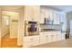 Modern kitchen includes stainless steel appliances, custom cabinets, and a built-in microwave at 3818 Bay Forest Way, Loganville, GA 30052