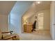 Attic office nook featuring a desk, chair and neutral carpeting at 3818 Bay Forest Way, Loganville, GA 30052