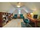 Attic office featuring a ceiling fan, bookshelves, and sitting area at 3818 Bay Forest Way, Loganville, GA 30052