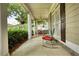 Covered porch featuring comfortable seating, ceiling fans, and scenic views at 3818 Bay Forest Way, Loganville, GA 30052
