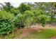 A serene, landscaped yard offers tranquility with lush greenery, mulch, and a decorative bird feeder at 3818 Bay Forest Way, Loganville, GA 30052