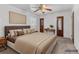 Comfortable staged bedroom with a ceiling fan, closet, and decorative furniture at 46 Hawkins Store Nw Rd, Kennesaw, GA 30144