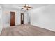 Carpeted bedroom featuring a ceiling fan and multiple doors at 46 Hawkins Store Nw Rd, Kennesaw, GA 30144
