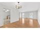 Dining area with hardwood floors, a chandelier, and connection to the kitchen at 46 Hawkins Store Nw Rd, Kennesaw, GA 30144