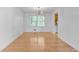 Dining room featuring hardwood floors, large windows, and a modern chandelier at 46 Hawkins Store Nw Rd, Kennesaw, GA 30144