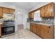 Bright kitchen featuring stainless steel appliances, tile backsplash, and ample cabinet space at 46 Hawkins Store Nw Rd, Kennesaw, GA 30144