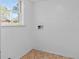 Small laundry room featuring a window, offering a functional space with simple design and natural light at 46 Hawkins Store Nw Rd, Kennesaw, GA 30144