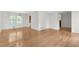 Spacious living room with hardwood floors, large windows and access to dining area at 46 Hawkins Store Nw Rd, Kennesaw, GA 30144