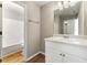 Bathroom with a white vanity, tub and shower combo, and modern fixtures at 6687 Hill Creek Cv, Lithonia, GA 30058